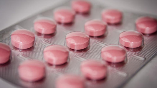 Close-up of pink tablets in a blister pack